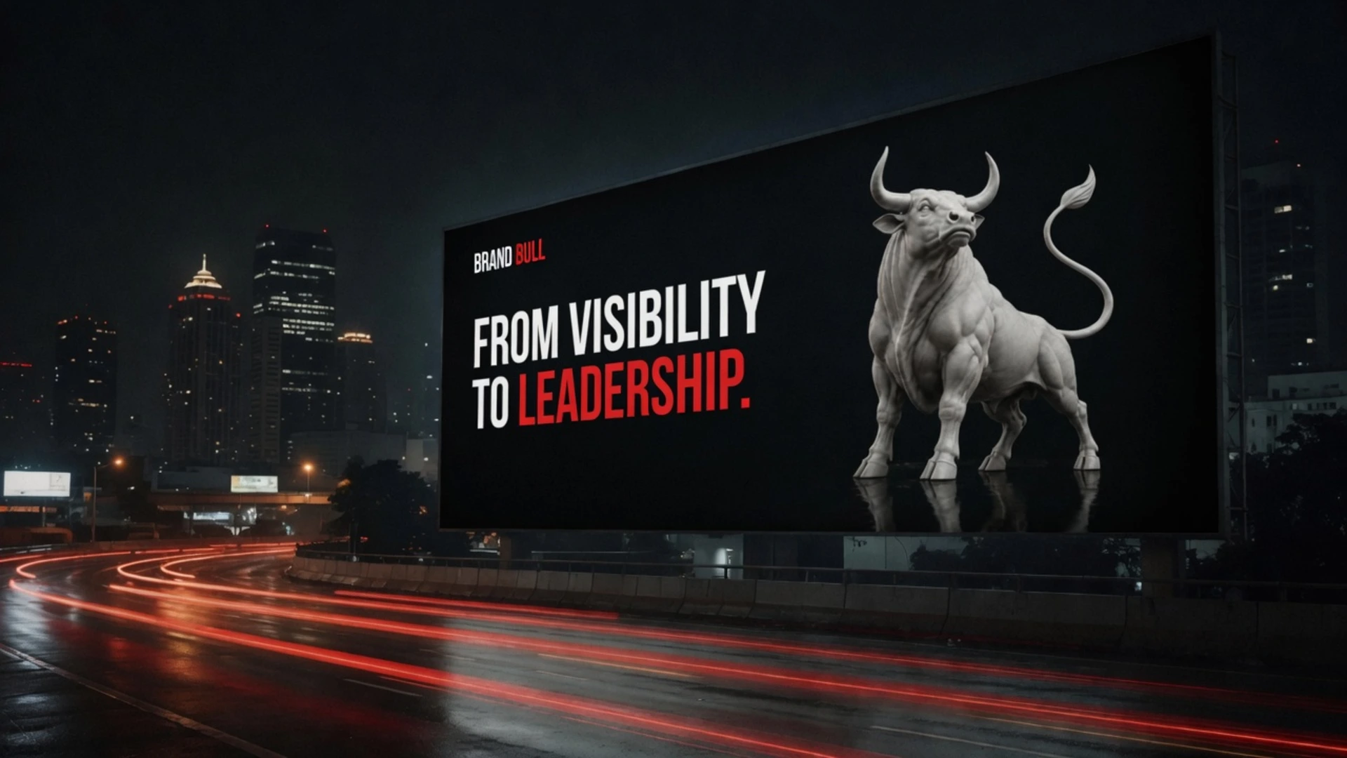 A Brand Bull billboard lighting a city expressway at night